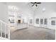 Open living room with high ceilings, hardwood floors, and access to deck at 3820 Mink Livsey Rd, Snellville, GA 30039