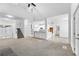 Spacious living room with high ceilings, carpeting, and a fireplace at 3820 Mink Livsey Rd, Snellville, GA 30039