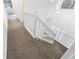 Elegant, carpeted staircase with white railing at 3820 Mink Livsey Rd, Snellville, GA 30039