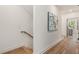 Light and bright hallway with hardwood floors and staircase at 1237 Memorial Se Dr # 401, Atlanta, GA 30316