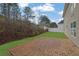 Brick patio and grassy backyard with privacy at 381 Paper Woods Dr, Lawrenceville, GA 30046
