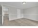 Bright bedroom featuring neutral decor and carpeting at 381 Paper Woods Dr, Lawrenceville, GA 30046