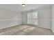 Spacious bedroom with neutral walls and carpet flooring at 381 Paper Woods Dr, Lawrenceville, GA 30046