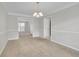 Spacious dining area with access to kitchen and living room at 381 Paper Woods Dr, Lawrenceville, GA 30046