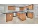 Modern kitchen with island, ample counter space, and stainless steel appliances at 381 Paper Woods Dr, Lawrenceville, GA 30046