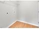 Laundry room with shelving and light wood flooring at 381 Paper Woods Dr, Lawrenceville, GA 30046