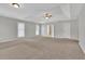 Bright main bedroom featuring carpet flooring, high ceilings, and access to en-suite bathroom at 381 Paper Woods Dr, Lawrenceville, GA 30046