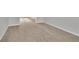 Empty bedroom showcasing neutral carpet and ample space for furniture at 381 Paper Woods Dr, Lawrenceville, GA 30046