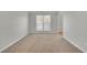 Spacious empty bedroom with neutral-toned carpet, ready for your personalization at 381 Paper Woods Dr, Lawrenceville, GA 30046