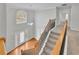 View of staircase leading to the upper level at 381 Paper Woods Dr, Lawrenceville, GA 30046