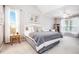 Bedroom with vaulted ceilings and natural light, a large bed, and neutral color palette at 173 Mill Creek Dr, Canton, GA 30115
