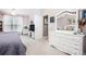 Bright bedroom with natural light, a large dresser, and neutral color palette at 173 Mill Creek Dr, Canton, GA 30115