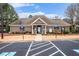 Community clubhouse featuring accessible parking and well-maintained landscaping at 173 Mill Creek Dr, Canton, GA 30115