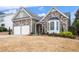 Lovely home with stone and siding exterior, featuring a two-car garage and well-maintained front yard at 173 Mill Creek Dr, Canton, GA 30115
