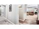 Inviting hallway with hardwood floors leading to a comfortable living area with natural light at 173 Mill Creek Dr, Canton, GA 30115