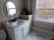 Clean bathroom with granite countertop, white vanity, and a large window at 650 Kingston Highway, Kingston, GA 30145