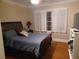 Comfortable bedroom with hardwood floors and a large window at 650 Kingston Highway, Kingston, GA 30145