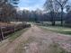 Gravel driveway with wooden fence alongside at 650 Kingston Highway, Kingston, GA 30145