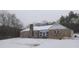 Stone house exterior in winter setting with snow on the ground at 650 Kingston Highway, Kingston, GA 30145