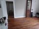 Long hallway with hardwood floors and access to other rooms at 650 Kingston Highway, Kingston, GA 30145
