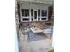 Inviting patio with stonework and outdoor seating at 650 Kingston Highway, Kingston, GA 30145