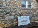 Exterior with charming stonework and house sign at 650 Kingston Highway, Kingston, GA 30145