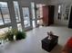 Sunroom with white flooring and many windows offering a view of the backyard at 650 Kingston Highway, Kingston, GA 30145