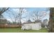 Spacious backyard with lush green lawn and a charming deck area for outdoor living and entertainment at 1288 Almont Sw Dr, Atlanta, GA 30310