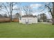 A spacious backyard with a new lawn and patio area that is perfect for outdoor activities and entertaining at 1288 Almont Sw Dr, Atlanta, GA 30310