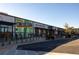 Exterior view of a commercial property with a modern design, multiple storefronts, ample parking, and contemporary architectural elements at 1288 Almont Sw Dr, Atlanta, GA 30310