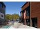 Exterior view of a commercial property with a brick facade, street parking, and clearly marked signage for Hop City at 1288 Almont Sw Dr, Atlanta, GA 30310