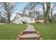 A charming home with a lush front yard and stone walkway creates a welcoming entrance and adds curb appeal at 1288 Almont Sw Dr, Atlanta, GA 30310