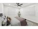 Comfortable bedroom with soft natural light, fan, and large windows at 1288 Almont Sw Dr, Atlanta, GA 30310