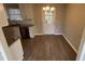 Kitchen dining area with white cabinets and vinyl flooring at 206 Sherwood Loop, Mcdonough, GA 30253