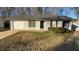Ranch style home with attached garage and landscaped lawn at 206 Sherwood Loop, Mcdonough, GA 30253