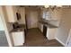 Galley style kitchen with white cabinets and granite counters at 206 Sherwood Loop, Mcdonough, GA 30253