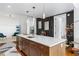 Modern kitchen island with white countertops and wood cabinets at 3630 Peachtree Ne Rd # 2005, Atlanta, GA 30326