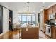 Open concept kitchen with island, stainless steel appliances, and hardwood floors at 3630 Peachtree Ne Rd # 2005, Atlanta, GA 30326