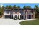 Modern two-story home with brick and wood siding, attached garage, and landscaped lawn at 1349 Oak Rd, Lilburn, GA 30047