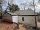 Rear view of house with detached garage and mature trees at 2669 Blount St, Atlanta, GA 30344