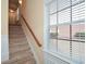 View of carpeted stairs and a window with blinds at 3649 Chattahoochee Summit Se Dr # 15, Atlanta, GA 30339