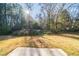 Private backyard with open space and mature trees at 1129 Winston Dr, Decatur, GA 30032