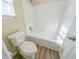 Clean bathroom with a bathtub, toilet, and vinyl flooring at 1129 Winston Dr, Decatur, GA 30032