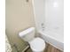 Clean bathroom featuring a toilet and a bathtub at 1129 Winston Dr, Decatur, GA 30032
