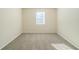 Bright bedroom with a window and neutral carpet at 1129 Winston Dr, Decatur, GA 30032