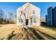 Tan two story house with a backyard and patio at 1129 Winston Dr, Decatur, GA 30032