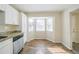 Eat-in kitchen with bay window and wood-look flooring at 1129 Winston Dr, Decatur, GA 30032