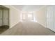 Spacious living room with neutral carpeting and walls at 1129 Winston Dr, Decatur, GA 30032