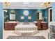 Luxurious bathroom features tile floor, an octagonal window, tiled tub, and double vanities at 837 Pine Ridge Dr, Lawrenceville, GA 30043