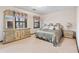 Bedroom featuring carpeted floor, a decorative mirror and curtains, and two windows at 837 Pine Ridge Dr, Lawrenceville, GA 30043